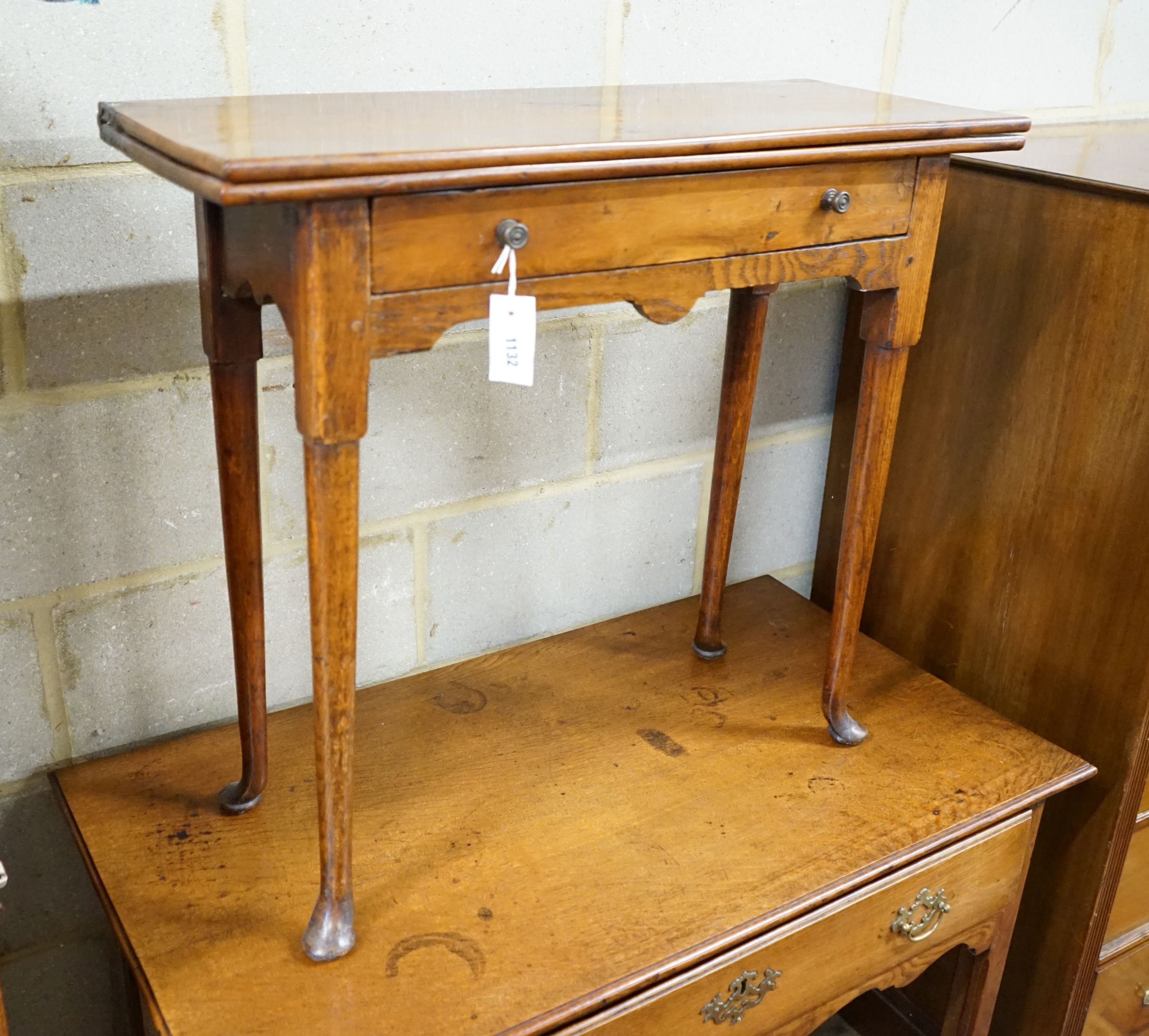 An 18th century provincial yew and oak rectangular folding tea table, width 80cm, depth 31cm, height 72cm